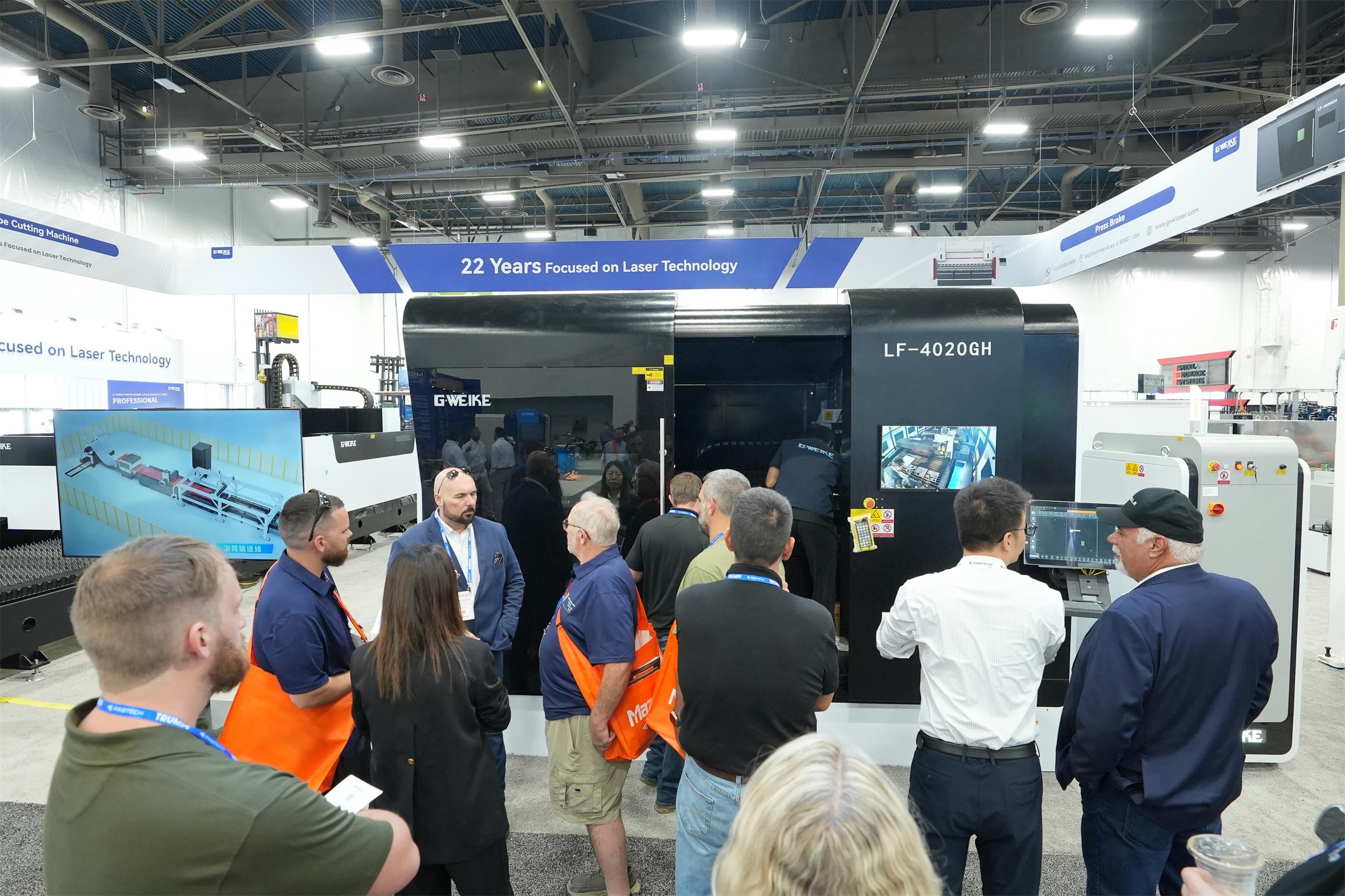 Visitors gather around GWEIKE equipment at FABTECH 2026 in Las Vegas